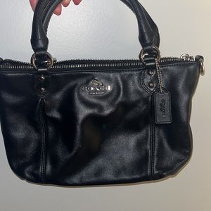 Small black leather coach hand bag.  Barely worn